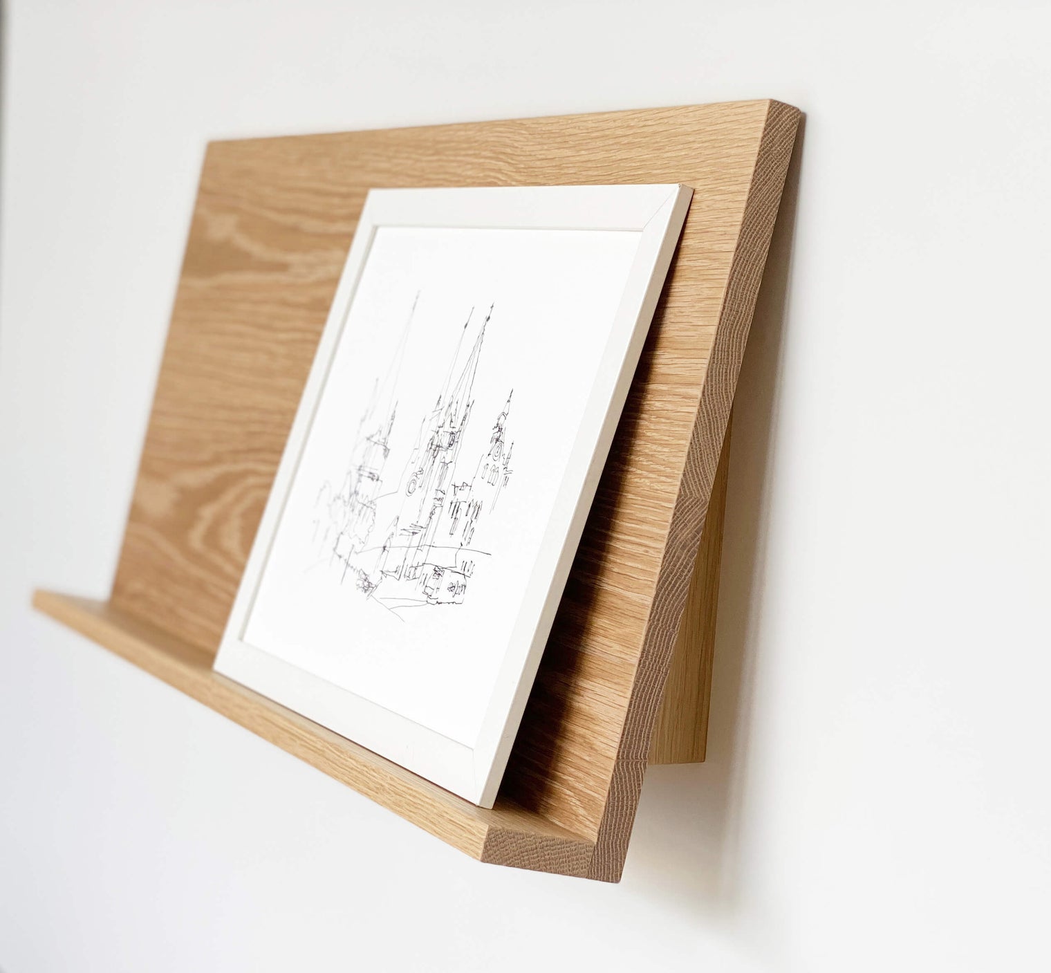 The Gallery Wall Shelf, Leaning shelf for art and photography with ledge in American Oak. Side View. Made in Melbourne