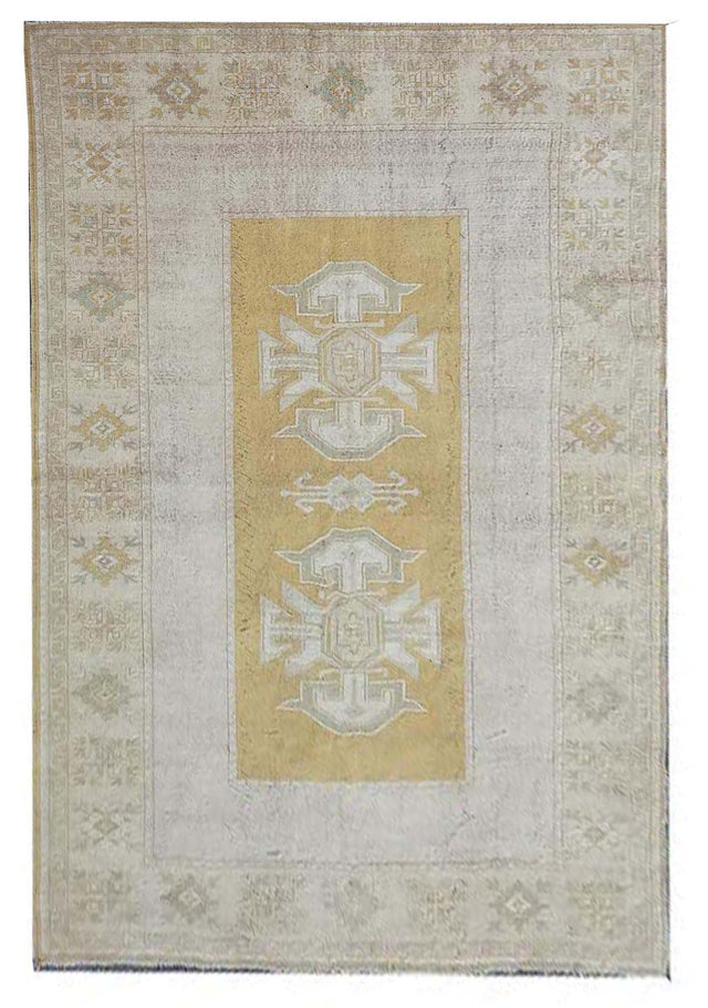 Vintage Handmade Turkish Rug with muted yellow tones and pale blue accents throughout the traditional border pattern. Dated from the 1960's. Traditional Vintage Turkish Rug available in Melbourne