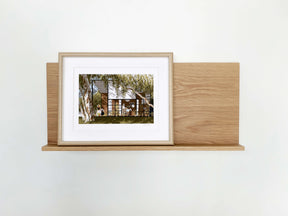 The Gallery Wall Shelf, Leaning shelf for art and photography with ledge in American Oak.  Australian Made Furniture