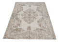 Vintage Handmade Turkish Rug with cream base and brown floral pattern. Dated from the 1960's. Traditional Vintage Turkish Rug available in Melbourne
