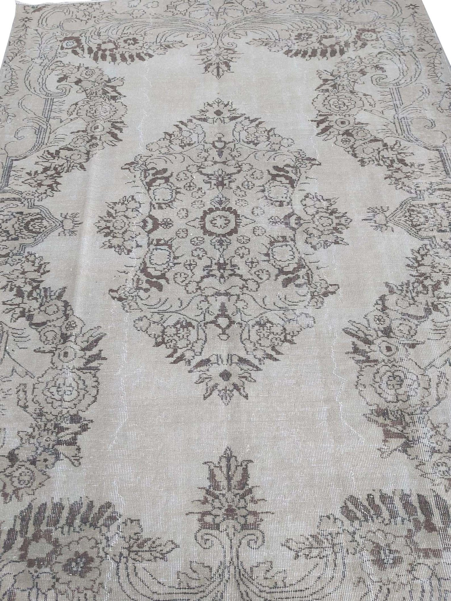 Vintage Handmade Turkish Rug with cream base and brown floral pattern. Dated from the 1960's. Traditional Vintage Turkish Rug available in Melbourne