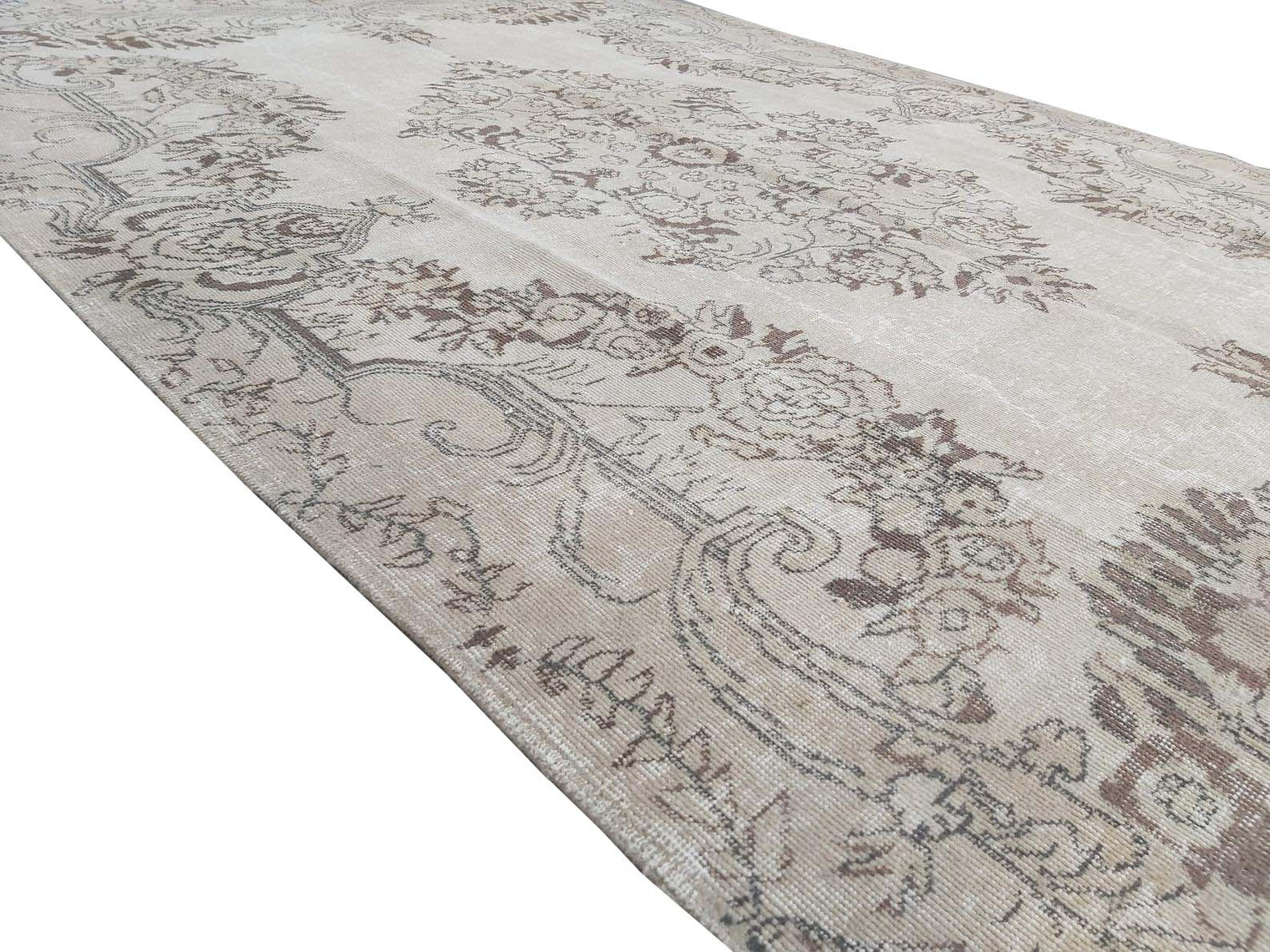 Vintage Handmade Turkish Rug with cream base and brown floral pattern. Dated from the 1960's. Traditional Vintage Turkish Rug available in Melbourne