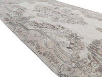 Vintage Handmade Turkish Rug with cream base and brown floral pattern. Dated from the 1960's. Traditional Vintage Turkish Rug available in Melbourne