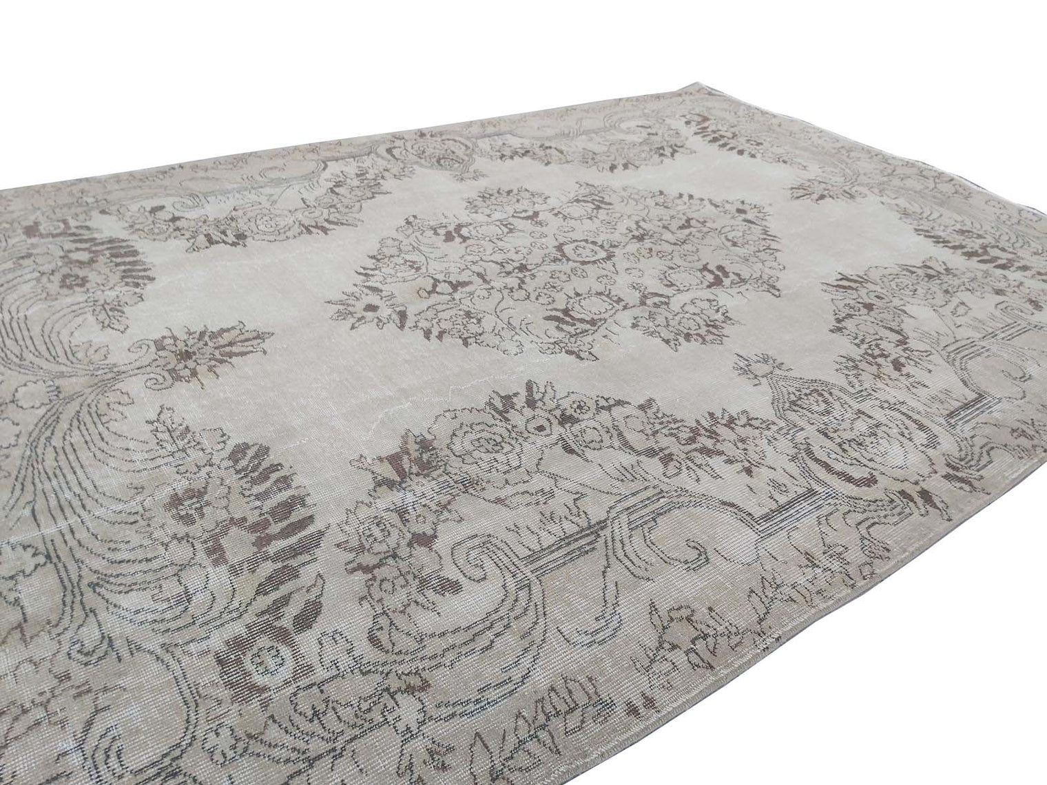 Vintage Handmade Turkish Rug with cream base and brown floral pattern. Dated from the 1960's. Traditional Vintage Turkish Rug available in Melbourne