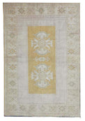 Vintage Handmade Turkish Rug with muted yellow tones and pale blue accents throughout the traditional border pattern.  Dated from the 1960's.  Traditional Vintage Turkish Rug available in Melbourne 
