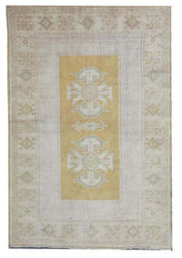 Vintage Handmade Turkish Rug with muted yellow tones and pale blue accents throughout the traditional border pattern.  Dated from the 1960's.  Traditional Vintage Turkish Rug available in Melbourne 