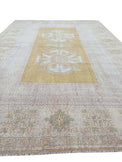 Vintage Handmade Turkish Rug with muted yellow tones and pale blue accents throughout the traditional border pattern.  Dated from the 1960's.  Traditional Vintage Turkish Rug available in Melbourne 
