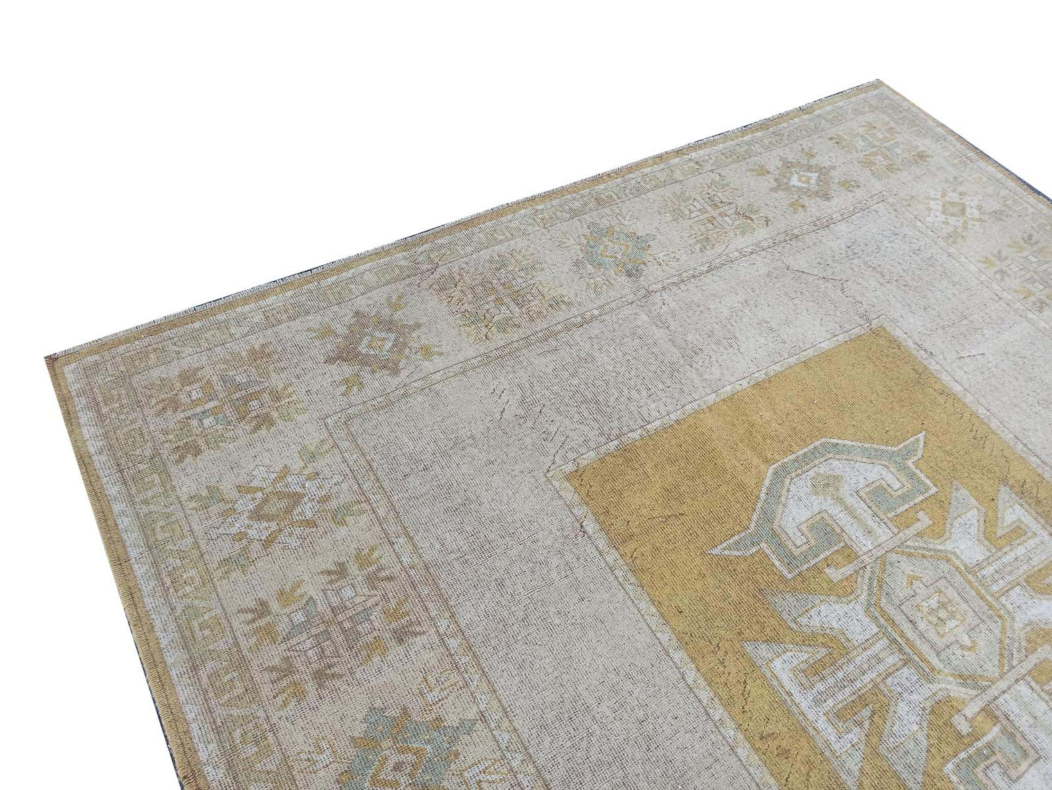 Vintage Handmade Turkish Rug with muted yellow tones and pale blue accents throughout the traditional border pattern.  Dated from the 1960's.  Traditional Vintage Turkish Rug available in Melbourne 