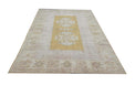 Vintage Handmade Turkish Rug with muted yellow tones and pale blue accents throughout the traditional border pattern.  Dated from the 1960's.  Traditional Vintage Turkish Rug available in Melbourne 